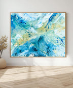 Original abstract canvas painting in blue, teal and golden tones, framed in natural oak. Expressive fluid brushwork by Danish artist Mette Lindberg, shown in Scandinavian interior setting