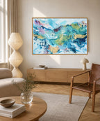 Large original abstract wall art on canvas, 100x150 cm, oak framed. Vibrant fluid brushwork in teal, warm gold, sky blue and dusty rose by Danish fine artist Mette Lindberg. Unique one-of-a-kind piece