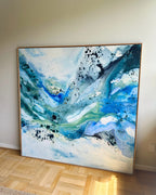 Original square abstract painting in teal, blue and soft green tones, in natural oak float frame, hanging above Danish dining table with Wishbone chairs and Panthella lamp – one-of-a-kind canvas artwork by Mette Lindberg