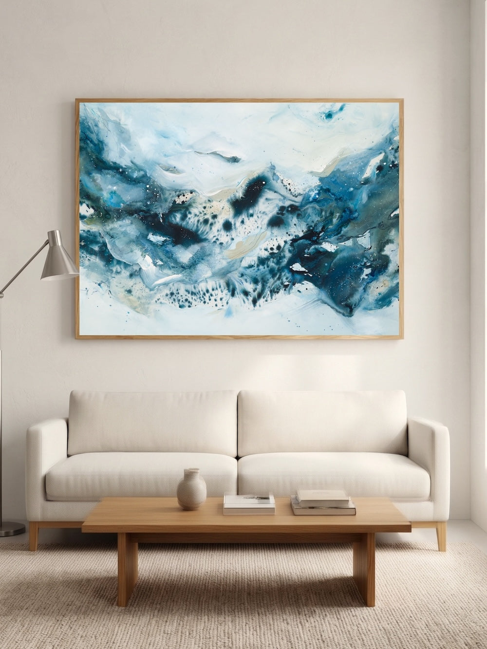 Large blue abstract art poster above sofa – modern art print in nordic style