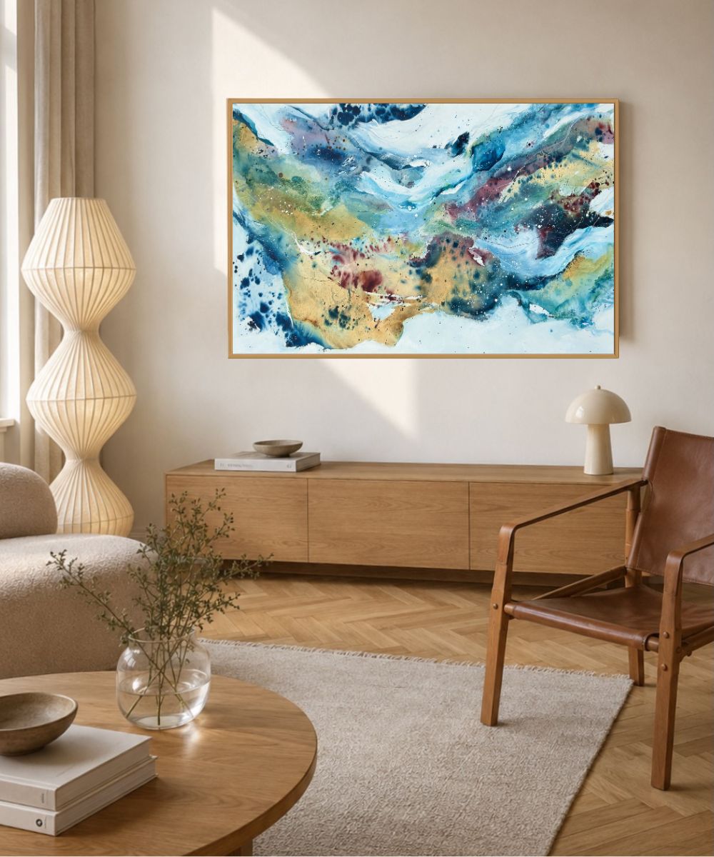 Soft #13 – original abstract canvas painting, 100x150 cm, in natural oak frame. Wide-format view of expressive fluid layers in teal, gold, blue and burgundy by Danish artist Mette Lindberg