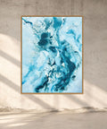 Soft #14 – original abstract canvas painting, 120x150 cm, in natural oak frame. Dynamic fluid blue and teal tones with expressive brushwork by Danish artist Mette Lindberg